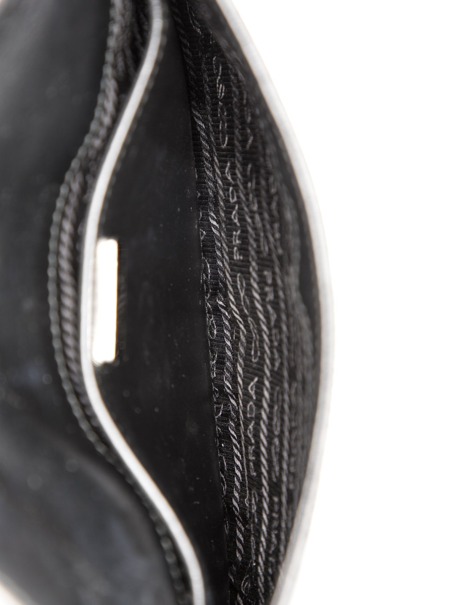 Prada Enameled Metal Triangle Cleo