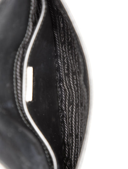 Prada Enameled Metal Triangle Cleo